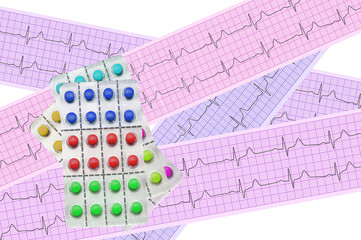 Tablets (pills) over heart analysis, electrocardiogram graph (EC