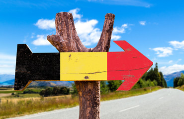 Belgium Flag wooden sign with road background