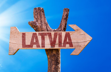 Latvia wooden sign with sky background