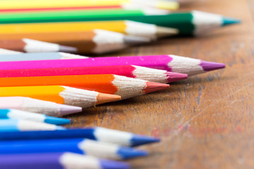 color pencils on wooden table