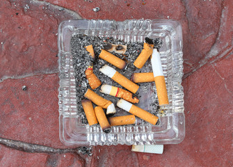 Cigarette butts discarded in ashtray