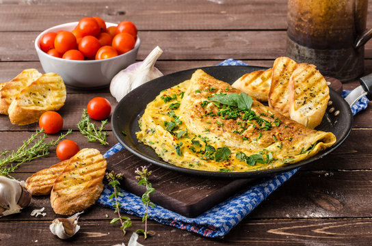 Herb omelette with chives and oregano sprinkled with Herb omelette with chili flakes