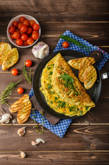 Herb omelette with chives and oregano sprinkled with Herb omelette with chili flakes