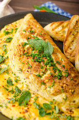 Herb omelette with chives and oregano sprinkled with Herb omelette with chili flakes