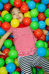 Fototapeta na wymiar Asian Chinese Girl In Ball Pool