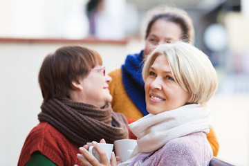 Senior women drinking tea at balcony