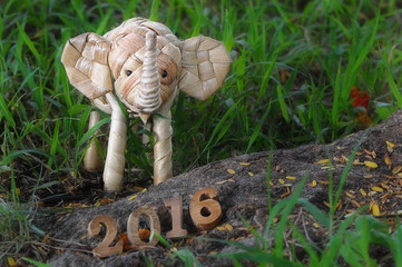 Happy New Year 2016 concept, elephant rattan handmade and wood number idea
