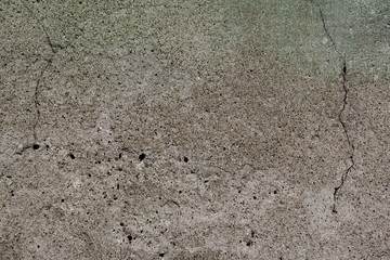 An old, concrete wall with cracks
