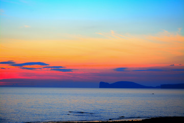 Obraz premium colorful sky over Capo Caccia at dusk