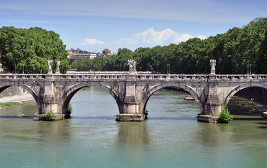 Old bridge and tourists in Rome