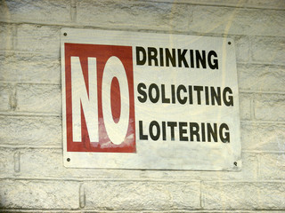 aged and worn vintage photo of no drinking sign