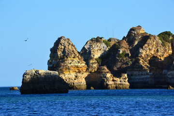 Fototapeta na wymiar Rocks and sandy beach in Portugal, Lagos