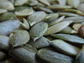 Many peeled roasted pumpkin seeds - healthy food.