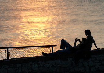 Young couple watching sunset 02