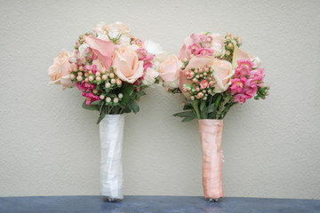 Two beautiful wedding bouquets of mixed flowers.