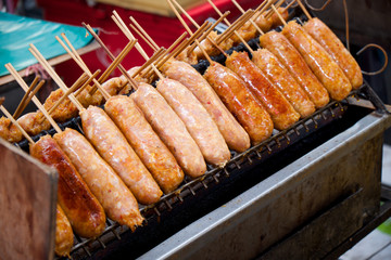 Thai style sausage being grilled