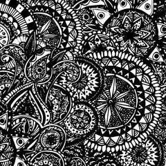 Black and white ornate hand drawn doodles with paisleys and