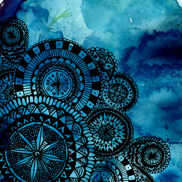 Blue watercolor brush strokes with black hand drawn mandalas -
