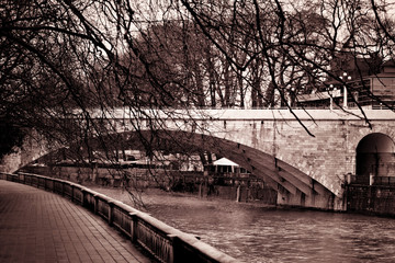 Landscape in the city park with river and bridge