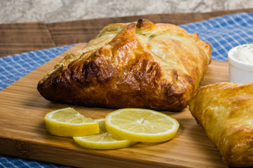 Baked wrapped salmon dinner with lemon