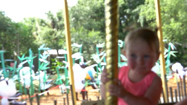 Little girl on merry-go-round, 4K