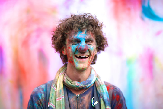 Laughing clown portrait against colorful background