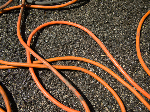 The Orange Extrnsion Cord on the Ground at the Constructionsite