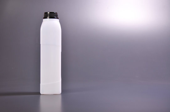 long rectangle empty white bottle with grey background
