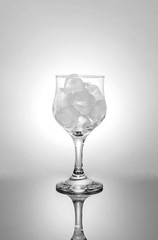 Ice in glass and light background.