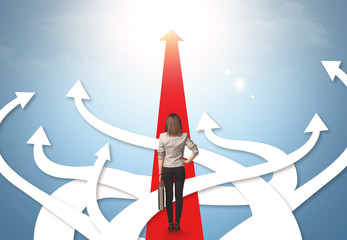 businesswoman with different direction arrows