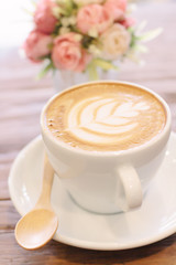 Cup of coffee latte art on wood table