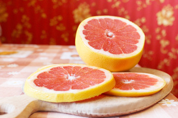 Fototapeta na wymiar grapefruit red cut by pieces