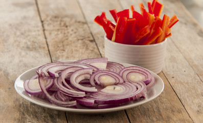 cut red pepper and red onion ready to cook