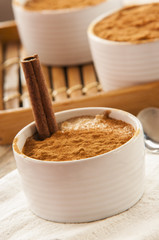 Creamy rice pudding sprinkled with cinnamon
