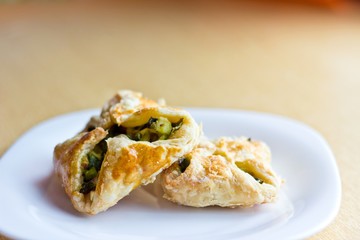 Fresh baked homemade puff pastry cakes with onion and egg