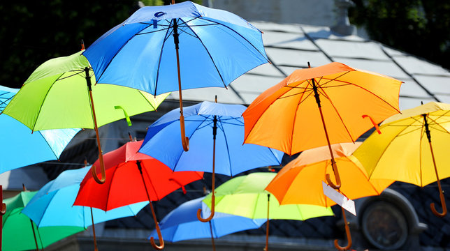 Street decorated with colored umbrellas.