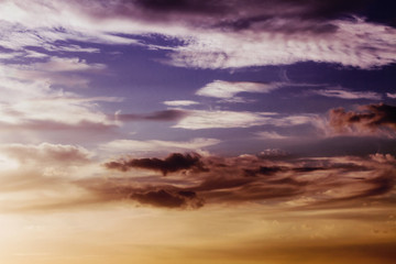 Sunset / sunrise with clouds, light rays and other atmospheric effect. Beautiful natural background.