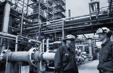 oil workers inside refinery, main filling station for shipping