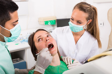 Patient is examined at dental clinic