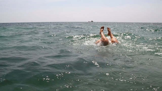 Young woman is swimming in the Black sea.