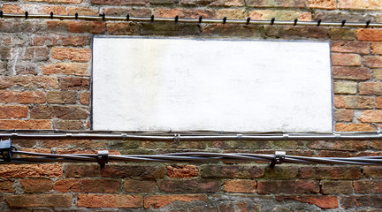 blank sign on brick wall