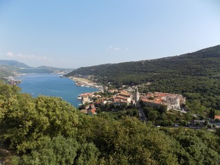 Forest, village, sea and sky