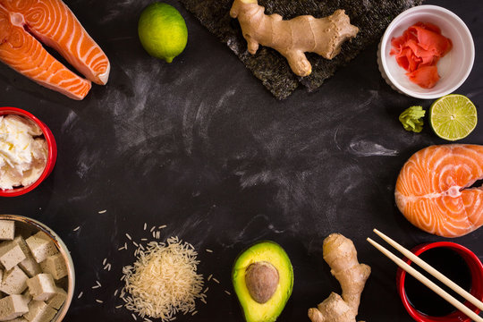 Overhead shot of ingredients for sushi on dark background