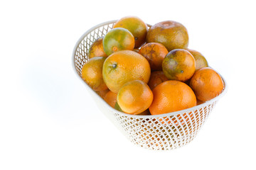 orange fruit in basket, isolated on white background