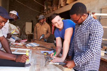 Obraz premium Men at work in a carpentry workshop, South Africa