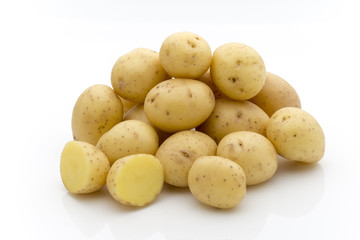 Potatoes on the white background.  New harvest.