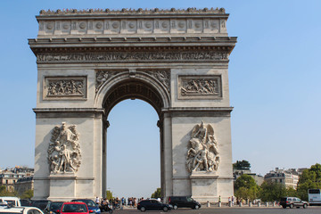 Fototapeta na wymiar Arc de Triomphe de l'Etoile is one of the most famous monuments in Paris. Arc de Triomphe was built in 1806-1836 by architect Jean Shalgrenom by order of Napoleon to commemorate victories of his Army.