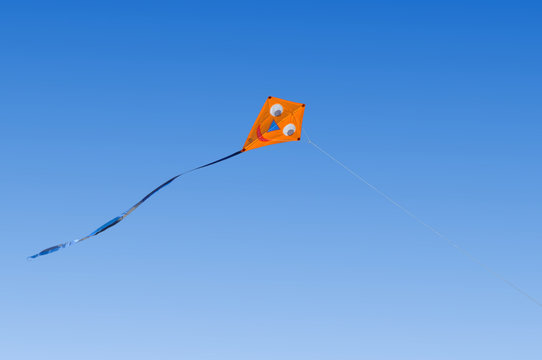 Kite flying in a blue sky © Stanisław Tokarski