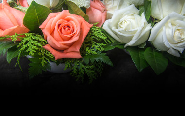 still life decorated orange color and white roses with various leaves