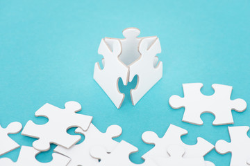 Three puzzle pieces as team